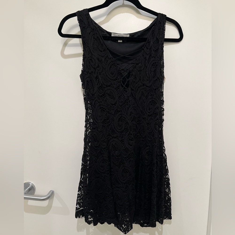 Lace black dress with front criss-cross detailing